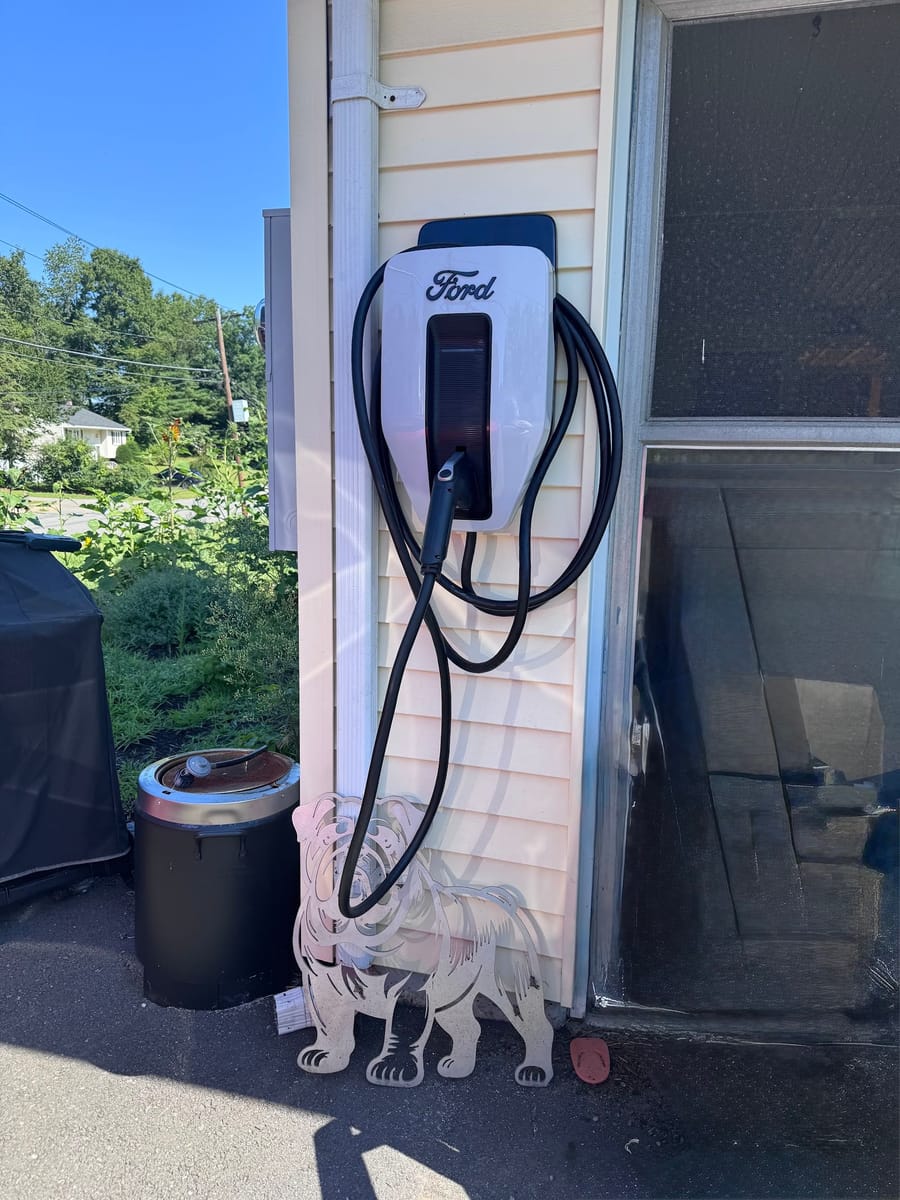 EV charger installed on a home exterior by Mike Mejia Electrical