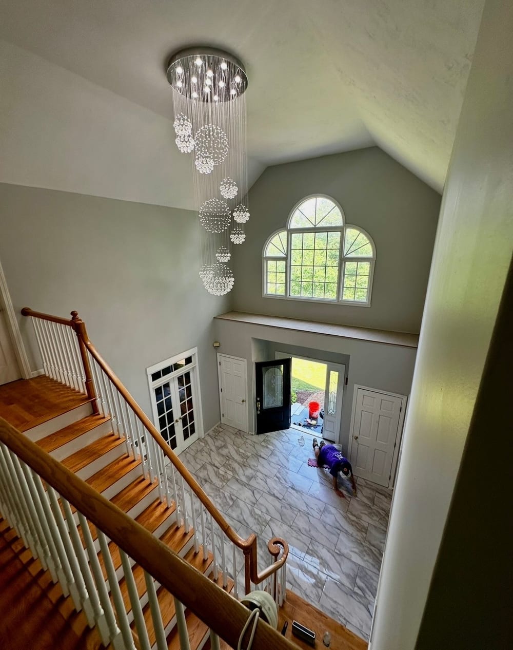 Two-story foyer chandelier installed by Mike Mejia Electrical